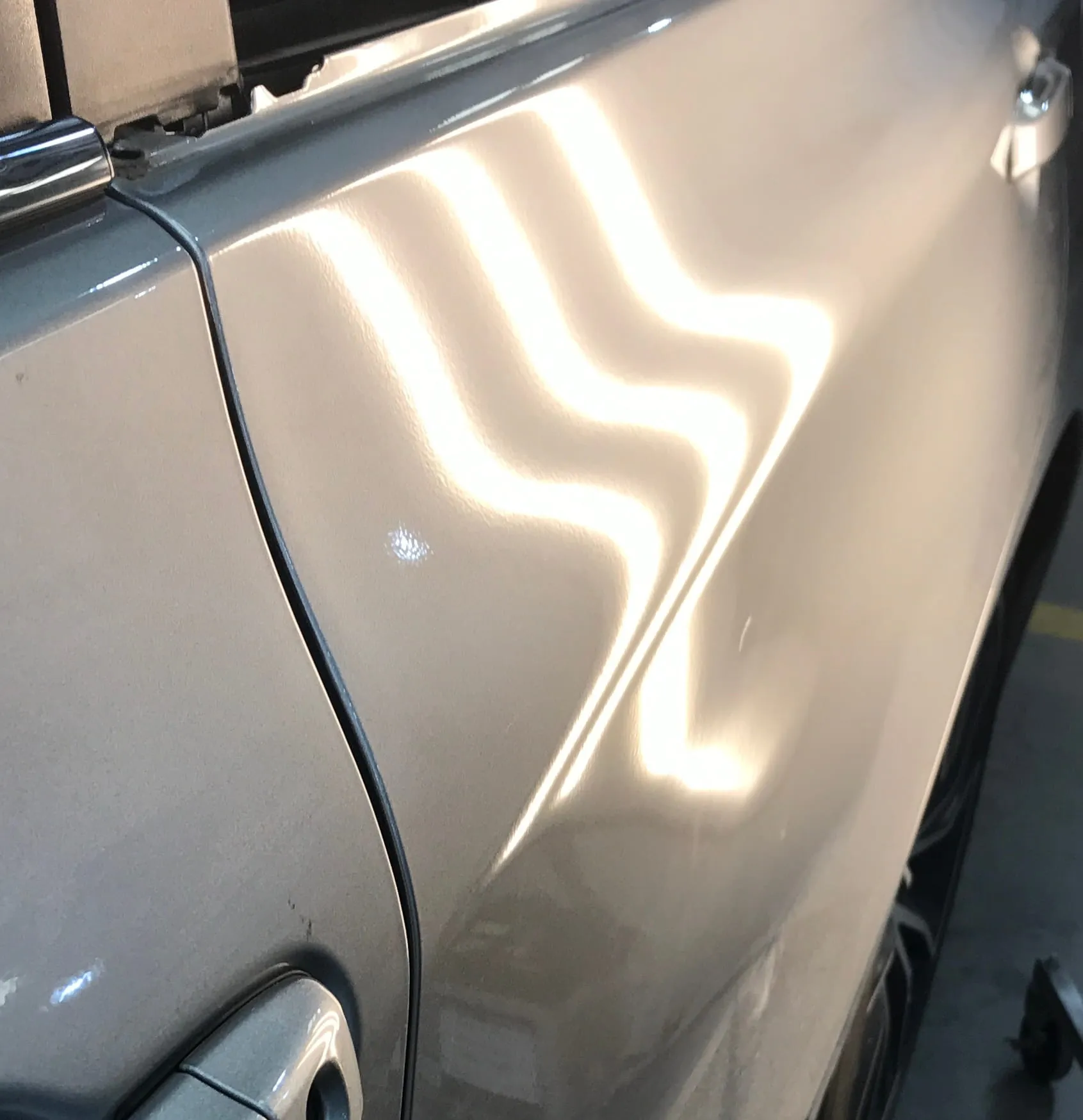 Deep panel dent fully restored to factory condition via PDR